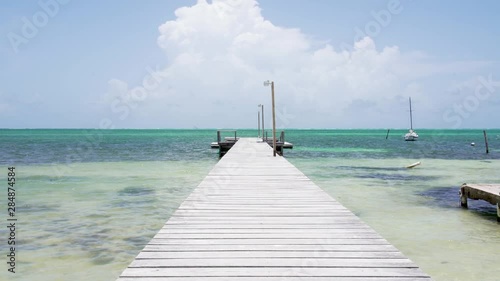 Empty Dock in Caye Caulker, Belize island in Caribbean Sea photo