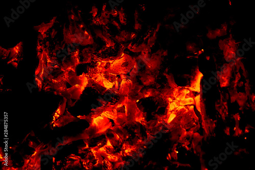 fireplace embers closeup glowing sparks orange light
