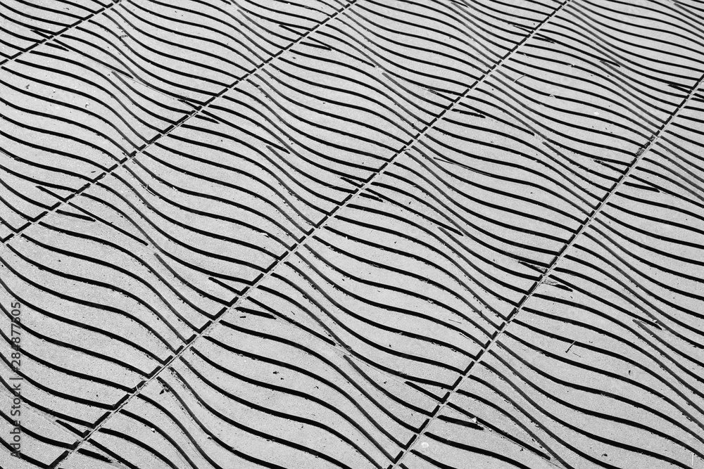 floor tiles in urban city street background - monochrome