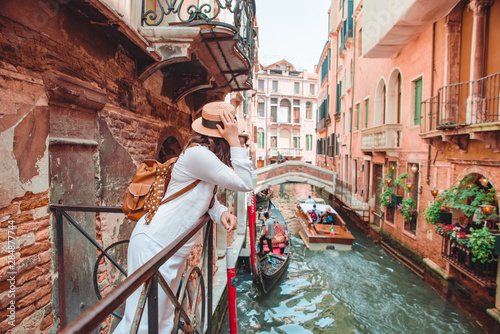 woman looking at canal with gandola © phpetrunina14