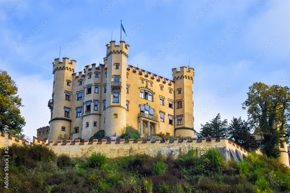 An ancient Hohenschwangau Castle under the morning sunlight in Bavaria with blue sky