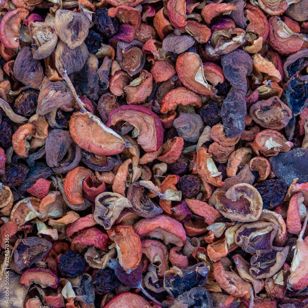mix of dried fruit apples, peaches and pears close-up, top view