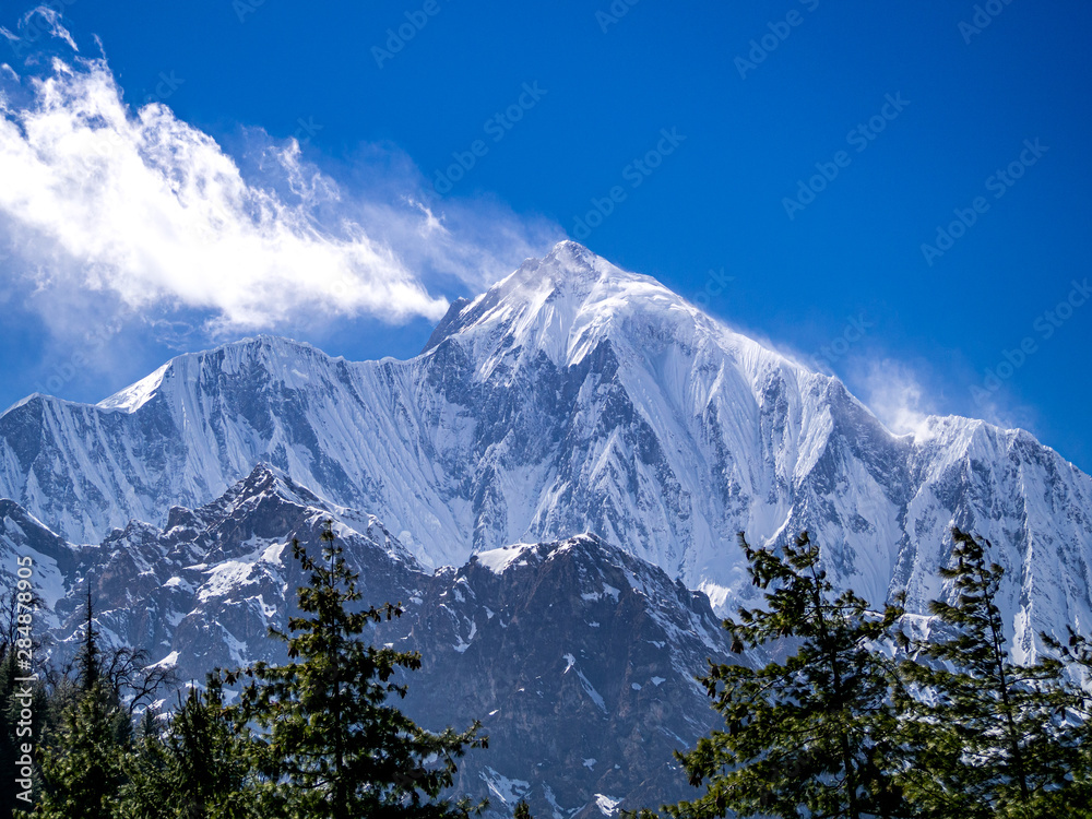 Ananapurna mountain with soft cloud and blue sky backround on Annapurna circuit trek in Himalayas Nepal