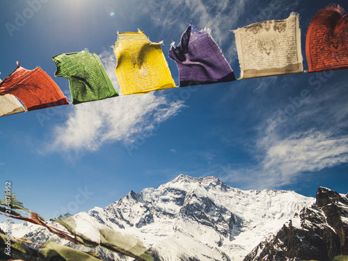 Annapurna mountain with colorful prayer flags scenery in Manang district Nepal