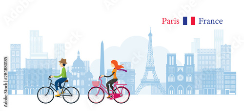 Couple Cycling with Paris France Skyline Background