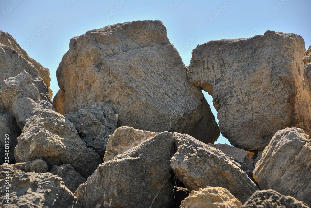 beach in Andalusia with rocks and palms