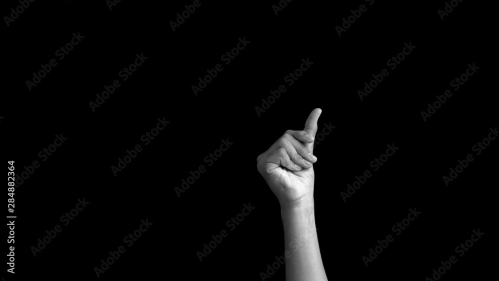 A SINGLE HAND OF CAUCASIAN WHITE COMING UP SNAPPING HIS FINGERS ISOLATED ON BLACK EASY TO USE FOR ANY COMMERCIAL PURPOSE.