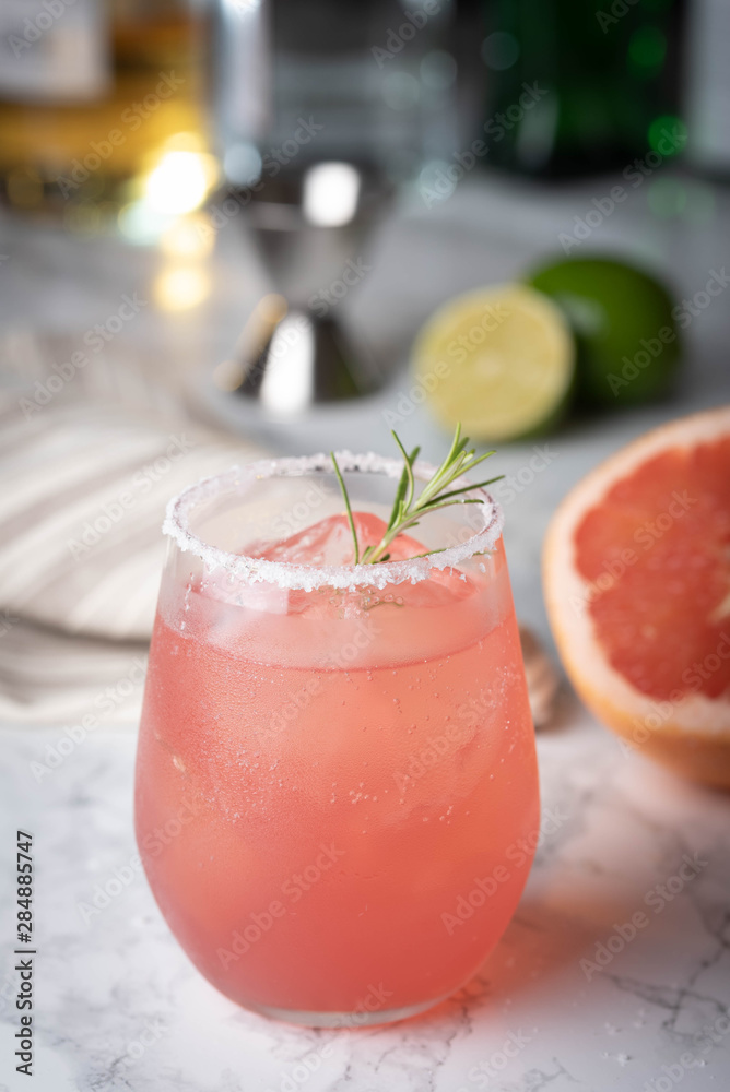 paloma cocktail with grapefruite on marble background paloma cocktail with grapefruite on marble background