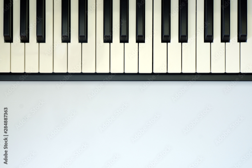 Music keyboard on white background close up view with free space for your text Music keyboard on white background close up view with free space for your text