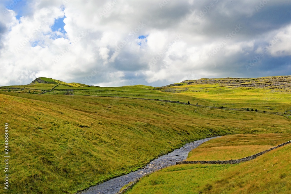 Naklejka premium Clouds gathering over Ingleton, in the Yorkshire Dales, on Saturday, 17th August, 2019.