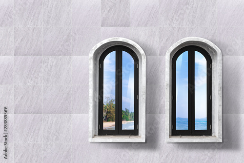 beach and sea view from wooden window frame and natural stone tile wall