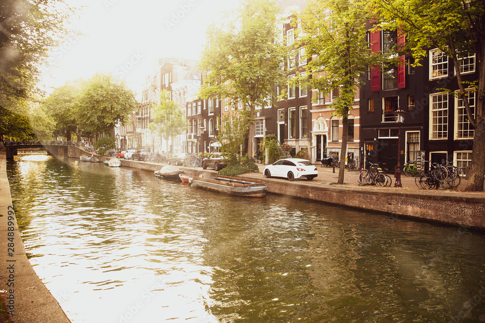 Amsterdam Canal with vintage tone on sun flare