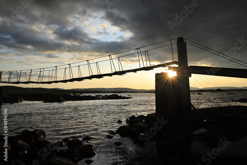 suspension bridge at the mountain photo