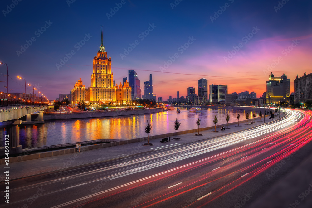 Moscow, Russia in sunset. Cityscape view to illuminated Hotel Ukraina, one of The Seven Sisters Stalinist style skyscrapers