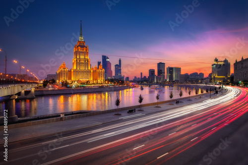Moscow, Russia in sunset. Cityscape view to illuminated Hotel Ukraina, one of The Seven Sisters Stalinist style skyscrapers
