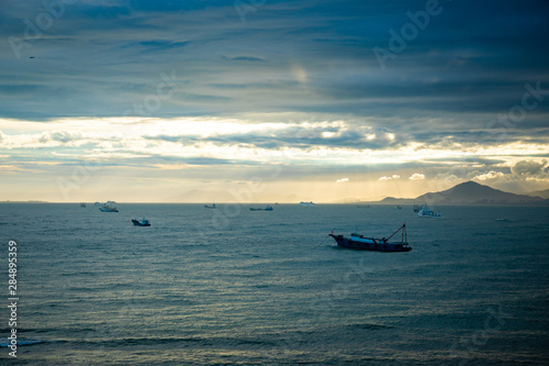 Fishing boat on sea in sunset lights in Sanya, Hainan, China