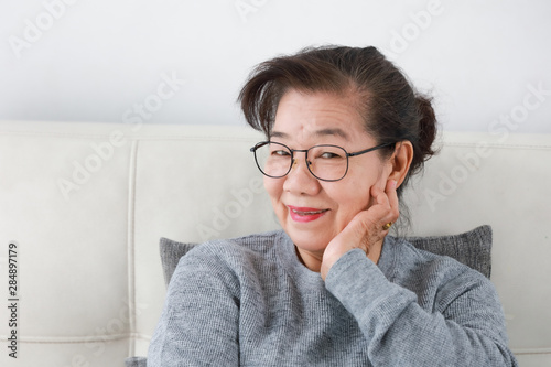 Asian senior grand mother in living room lifestyle happy face