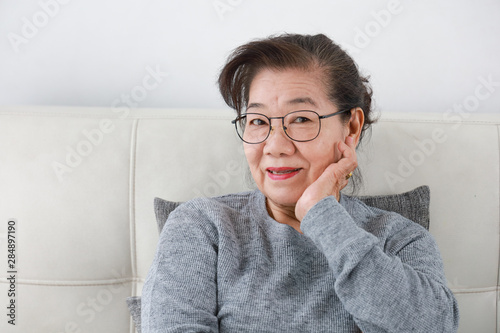 Asian senior grand mother in living room lifestyle happy face
