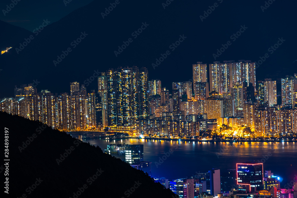 Naklejka premium Hong Kong cityscape at night, sky scraper building