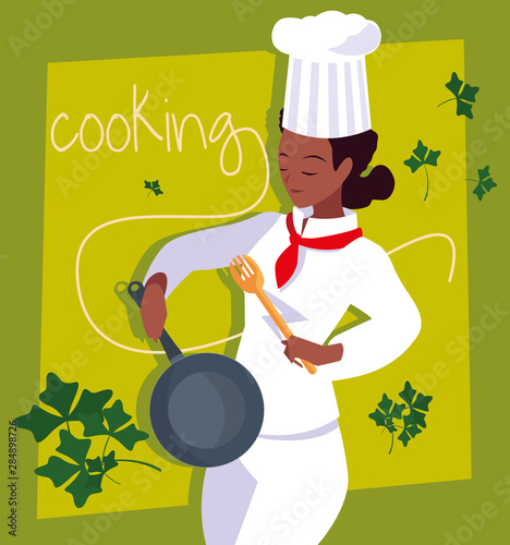 professional chef female cooking with pan of kitchen