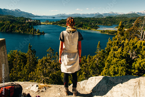 girl is looking at Nahuel Huapi lake, San Carlos de Bariloche Argentina photo
