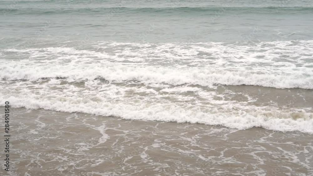 Calm evening ocean surf. Foamy waves fill the sandy beach. Ocean Meditation Concept Calm evening ocean surf. Foamy waves fill the sandy beach. Ocean Meditation Concept