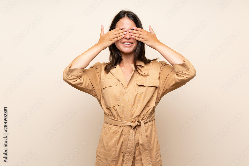 Young girl over isolated background covering eyes by hands Young girl over isolated background covering eyes by hands