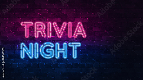 trivia night neon sign. purple and blue glow. neon text. Brick wall lit by neon lamps. Night lighting on the wall. 3d illustration. Trendy Design. light banner, bright advertisement photo