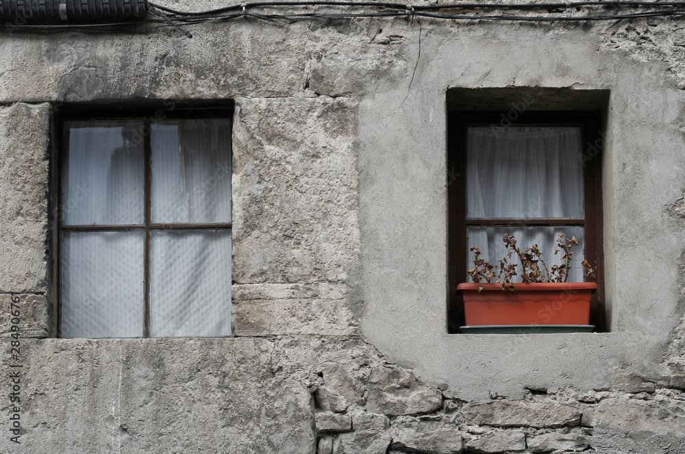 Fototapeta premium old window in stone wall