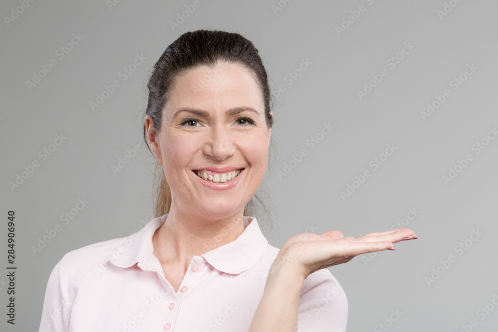 mid age woman is presenting her open hand mid age woman is presenting her open hand