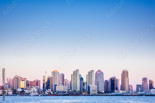 USA. California. San Diego skyline from the harbor at dusk.