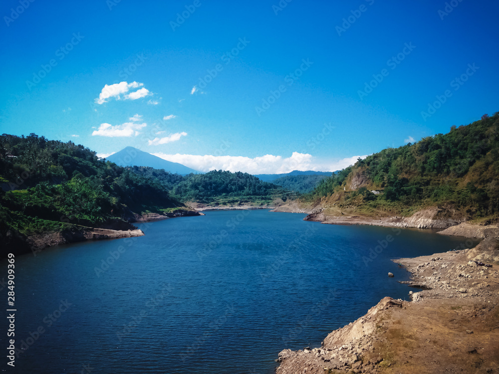 Obraz premium Beautiful View Of Lake Water Titab Ularan Dam Landscape Between The Hills In The Dry Season, North Bali, Indonesia