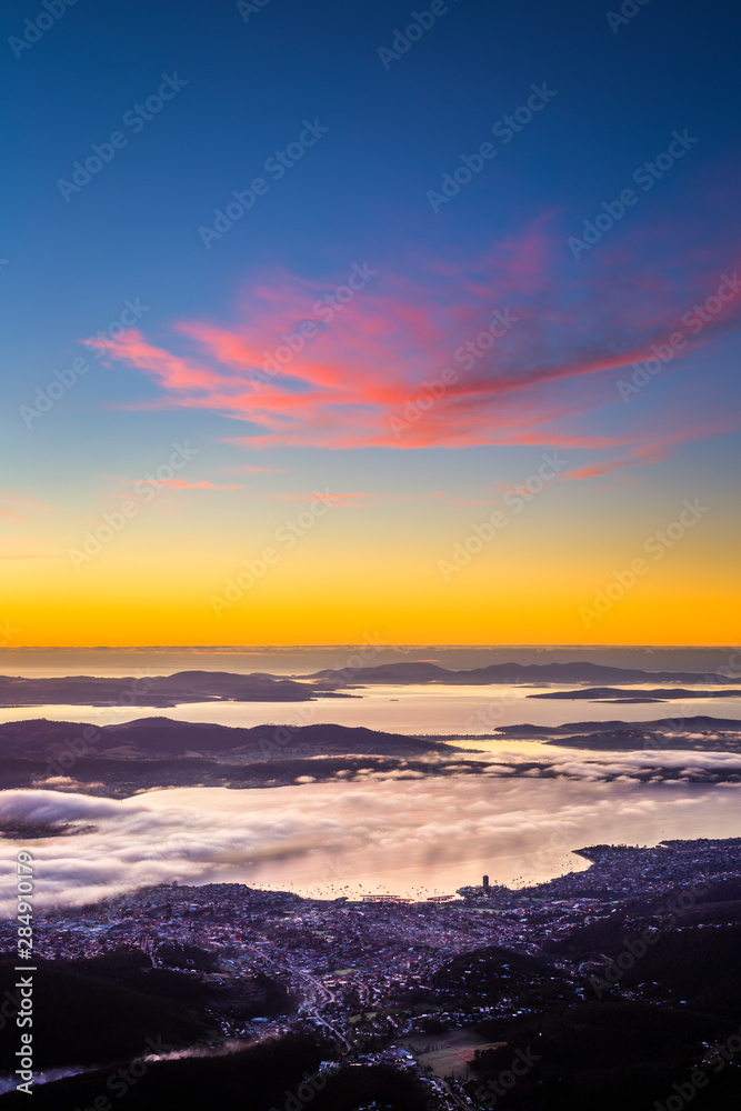 Hobart city with fog over River Derwent during sunrise Hobart city with fog over River Derwent during sunrise
