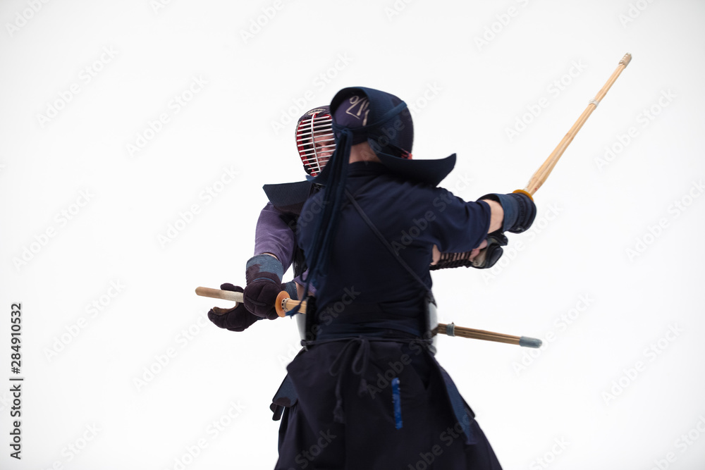 Kendo martial arts fighters in silhouette isolated on white bacground. the japanese script is the name of the fighter, blank is for the beginners regarding rules Kendo martial arts fighters in silhouette isolated on white bacground. the japanese script is the name of the fighter, blank is for the beginners regarding rules