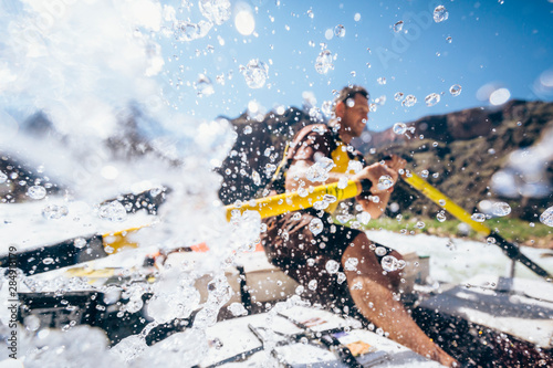 Man rows raft through Granite Rapids, Arizona