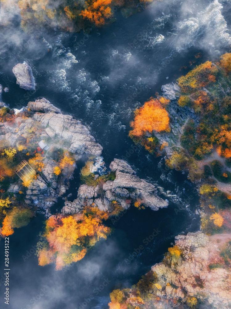 aerial drone view of colorful forest, blue river and rocks. beautiful autumn landscape