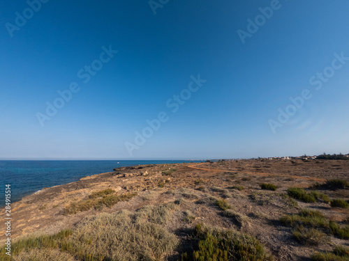 View of the beautiful San Lorenzo rock beach  in the southern Sicily  Italy. The shot is taken during a sunny summer day