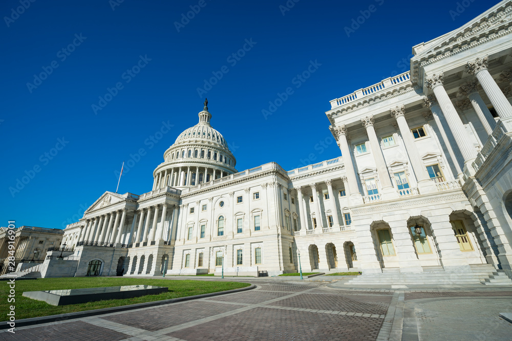 Bright morning view of the traditional neoclassical architecture of the Capitol Building’s plaza in Washington DC, USA