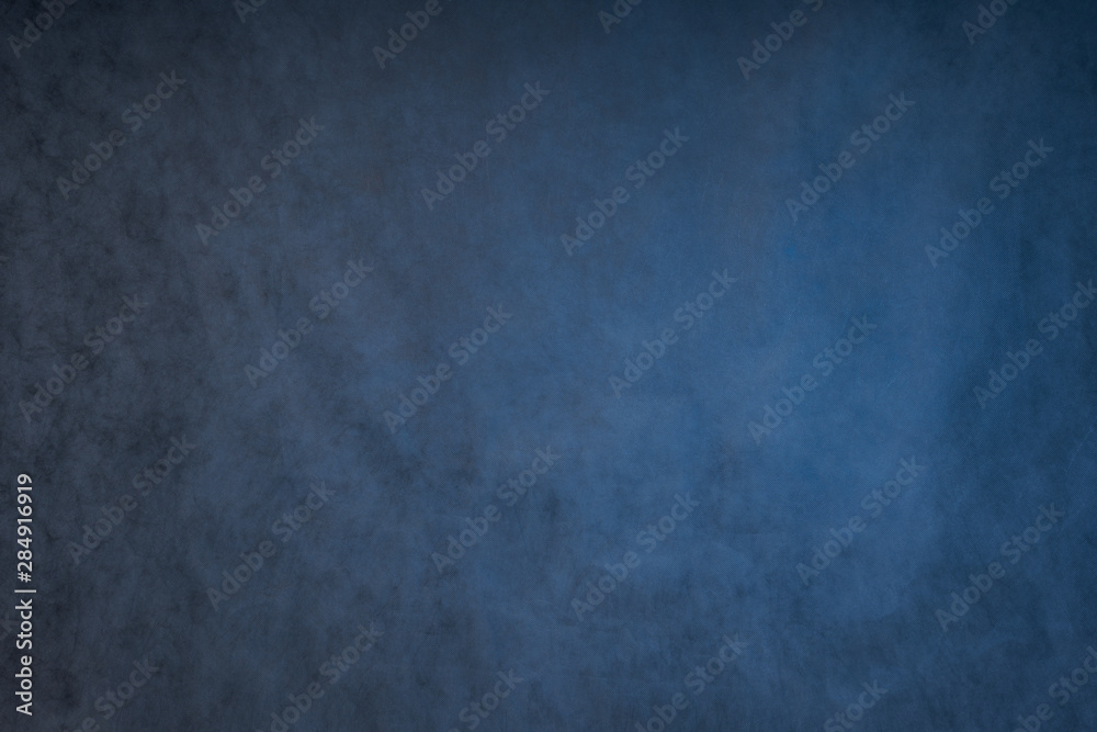 blue grey abstract background, the Studio wall is illuminated by constant light