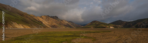 Beautiful scenic panorama of colorful volcanic mountains in Landmannalaugar camp site area of Fjallabak Nature Reserve in Highlands region of Iceland