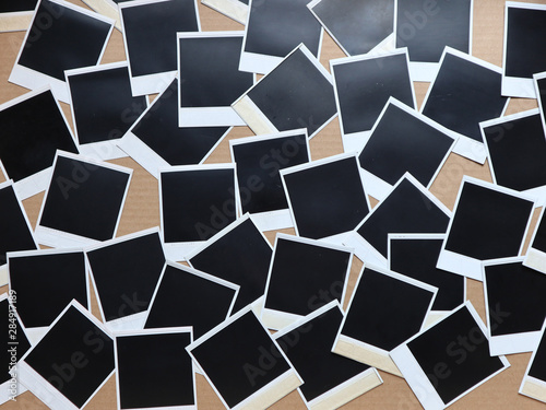 Set of retro photo frames Many polaroid on a cardboard background Vintage Pictures . Top view. Flat lay