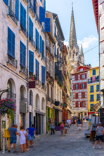 Tableau sur toile Street with historical houses in Bayonne city center. France
