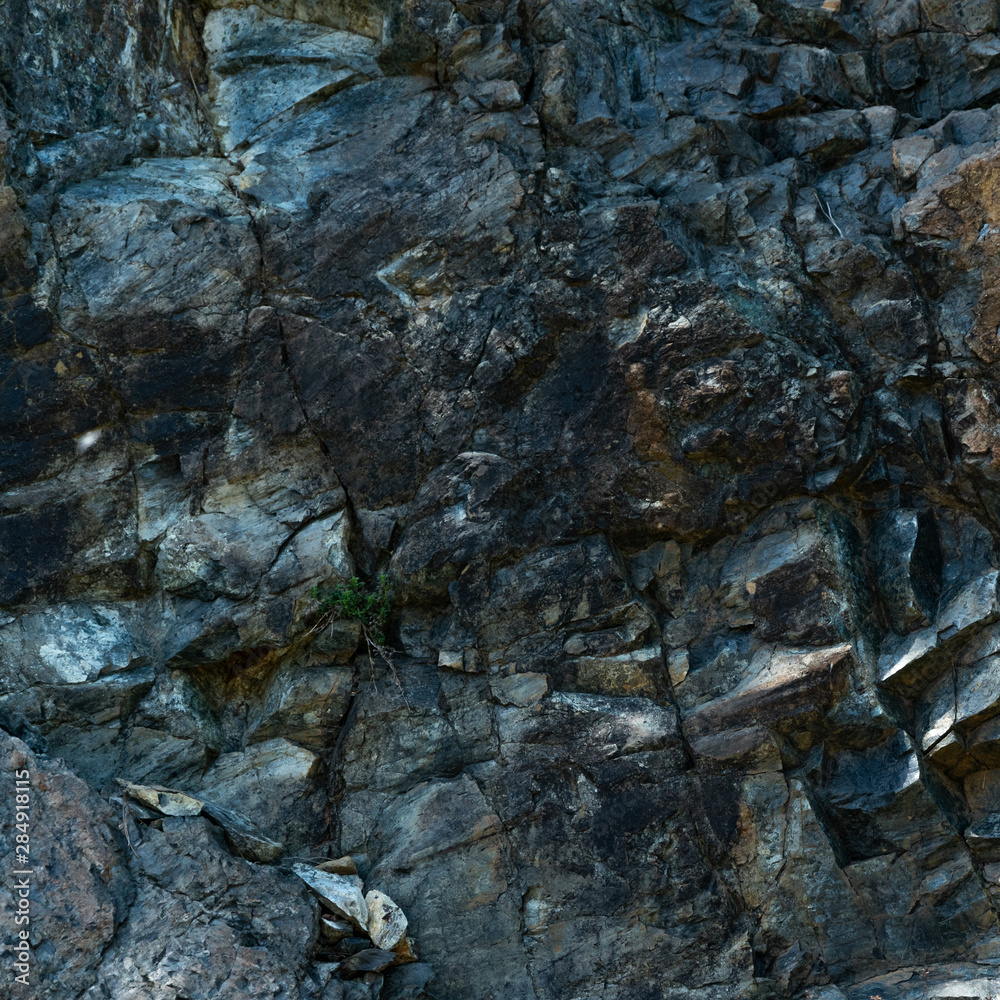 Fototapeta premium Stone background. Rocky rough textured backdrop