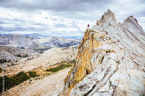 Woman standing on edge of Matthes Crest photo