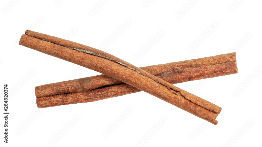 two dried Cinnamon sticks cut out on white two dried Cinnamon sticks cut out on white