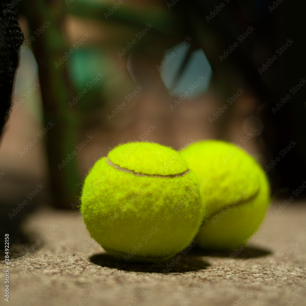 two tennis ball are place on outer court