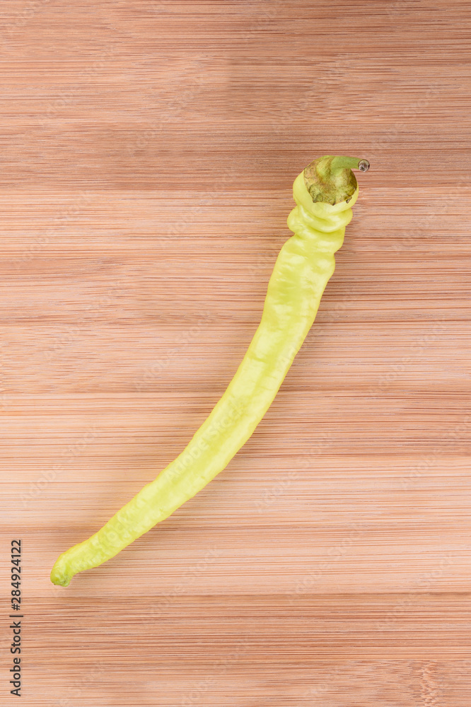 Hot green peppers on a wooden background. Vertical Hot green peppers on a wooden background. Vertical