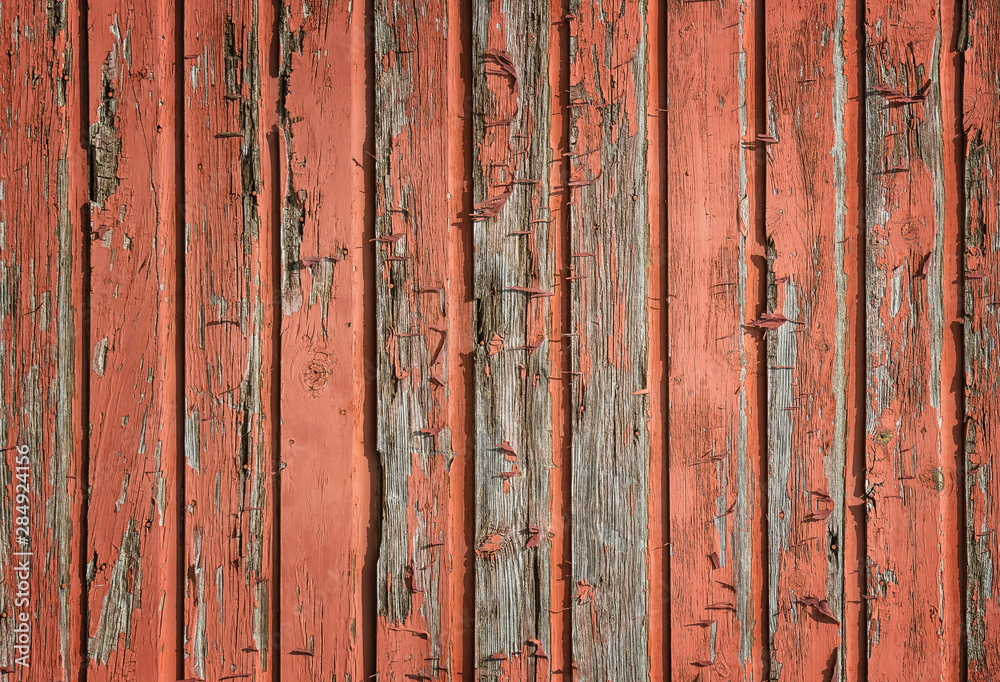 Weathered, rustic and faded, red wood planks background Weathered, rustic and faded, red wood planks background