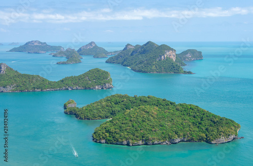 Green islands in the azure sea. Ocean and small tropical islands. Paradise exotic seascape scenery