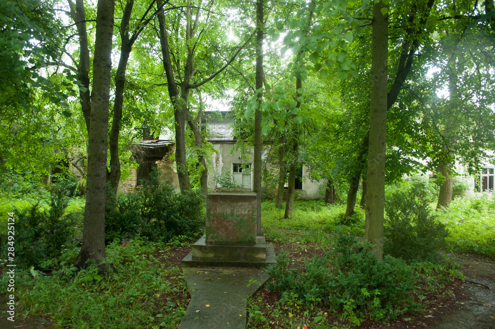 memorial with date near the enter to abandoned hospital